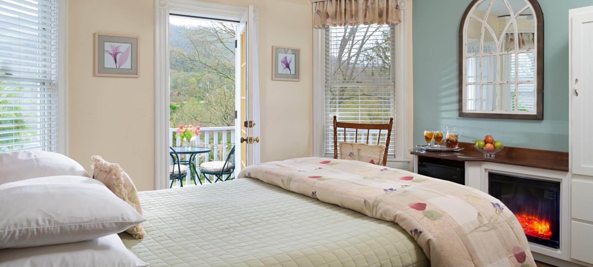 Mountain View Room bedroom with queen size bed, private porch and electric fireplace