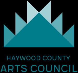 Logo of the Haywood County Arts Council featuring a teal mountain design.