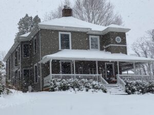 Front view of the Andon-Reid Inn during a snow shower