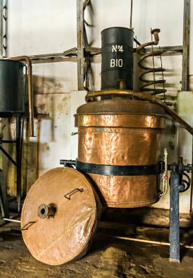 Copper barrel with black metal banding for wine making